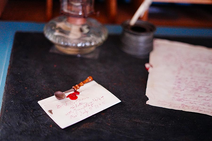 image of letter written and left on a desk at the Baldwin Home.